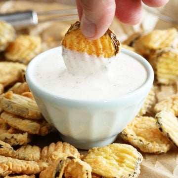 Dipping Fried Dill Pickles in sauce