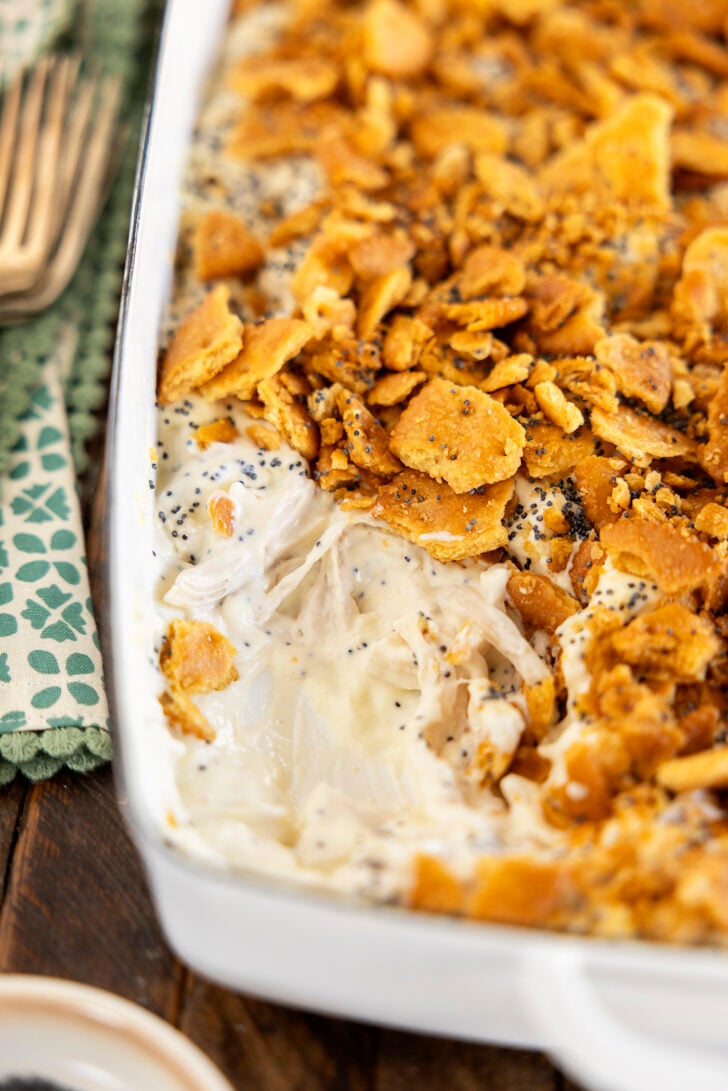 Poppy Seed Chicken Casserole with a serving missing.
