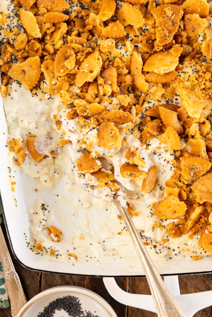 Poppy Seed Chicken Casserole with a serving missing.