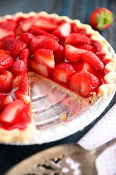 Strawberry pie with piece missing