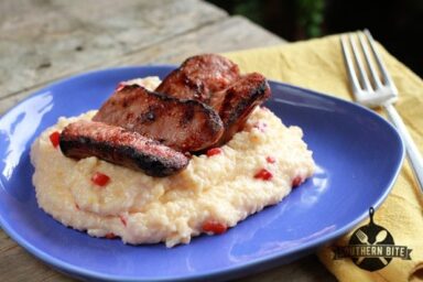 Plate of Grilled Sausage with Pimiento Cheese Grits
