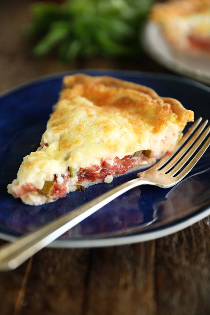 Slice of tomato pie on plate.