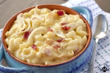 Mac and Cheese Soup with Chicken and bacon in blue bowl