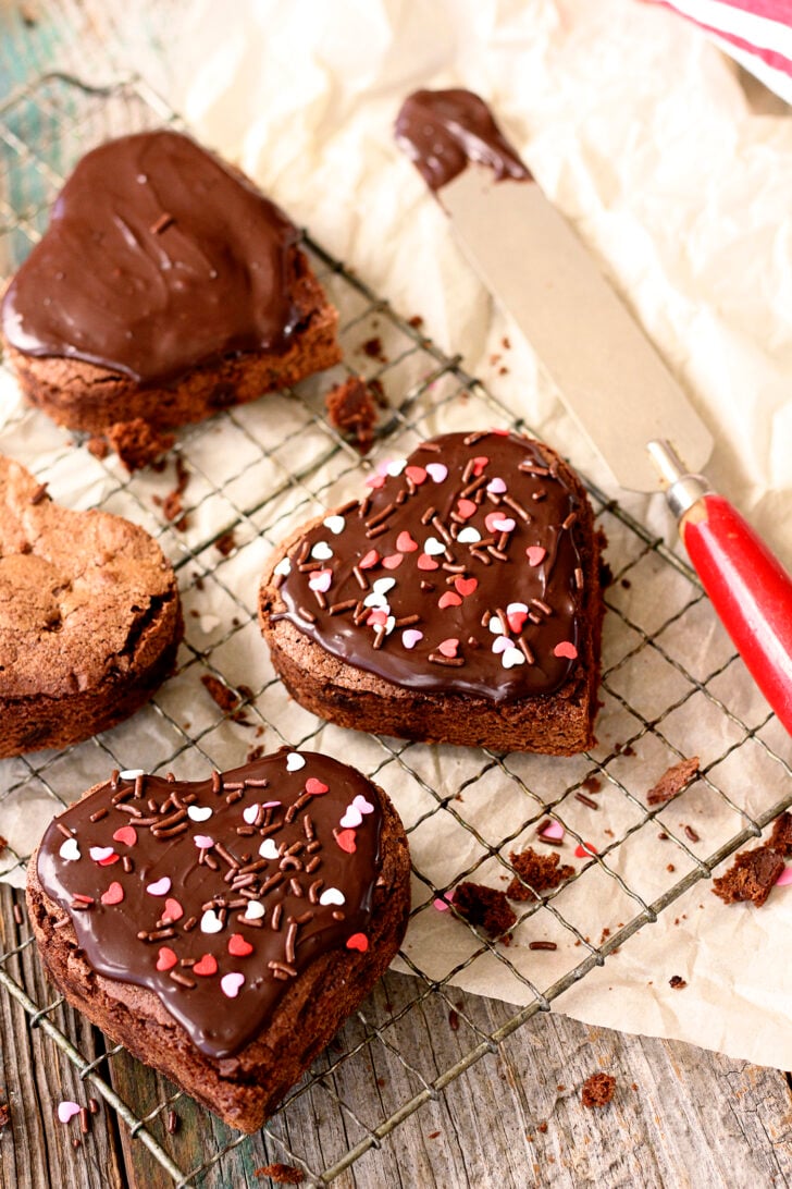 Heart-shaped brownies with chocolate ganache frosting.