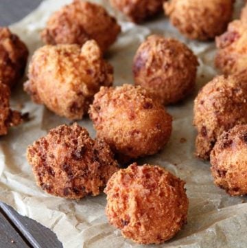 These Pimiento Cheese Hush Puppies need to be on your MUST MAKE list! The tangy pimiento and gooey cheese take the ordinary to extraordinary!