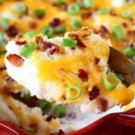 This Shortcut Loaded Mashed Potato Casserole will be an instant hit with your family!