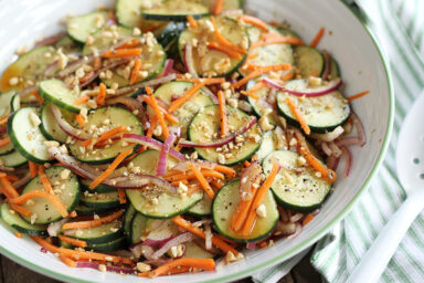 Garlic Soy Cucumber Salad on Stripped Towel.