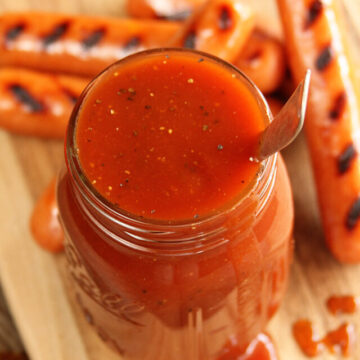 Coca Cola BBQ Sauce with hot dogs in background