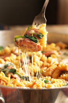 Simple One Pan Sausage Pasta being served with fork