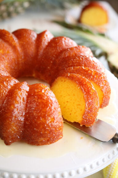 Pineapple Juice Cake while serving a slice close photo