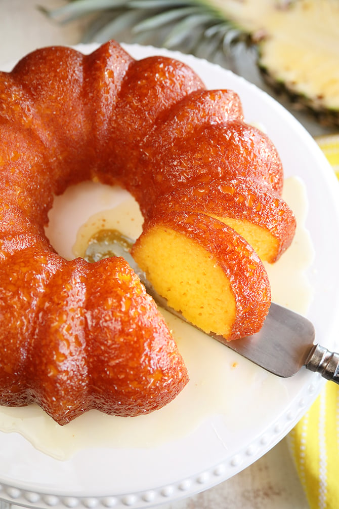 This recipe for Pineapple Juice Cake starts with a cake mix, adds pineapple juice in the batter, and then the cake is bathed in a butter-pineapple juice glaze. It's so easy, but super delicious! 