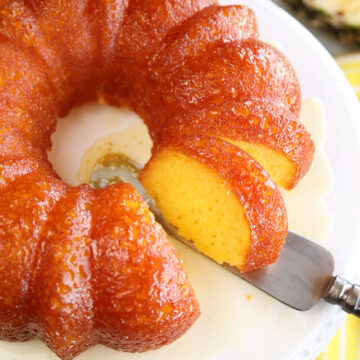 Pineapple Juice Cake while serving a slice