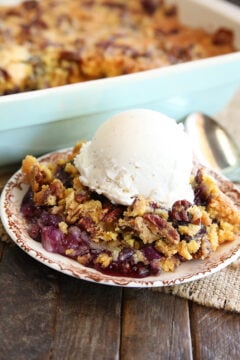 Pineapple Blueberry Dump Cake Served in dish with ice cream on top