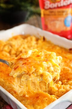 Cheesiest Mac and Cheese in casserole dish with package of cheese