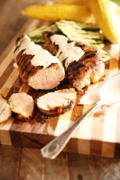 Grilled Pork tenderloin with white bbq sauce over it