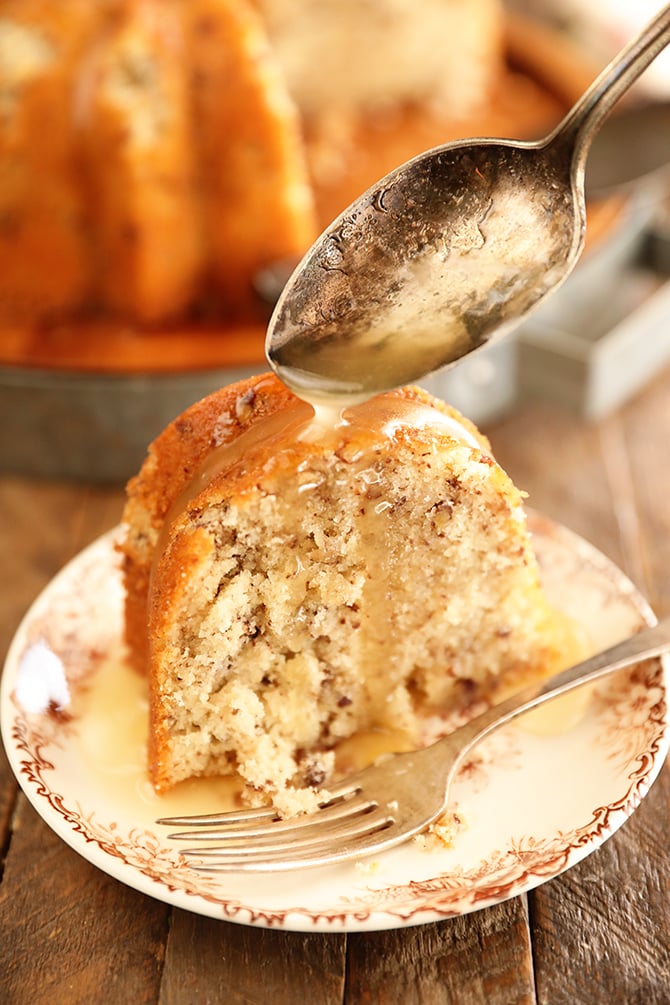 Bama Butter Cake with Butter Sauce Being Spooned over the top