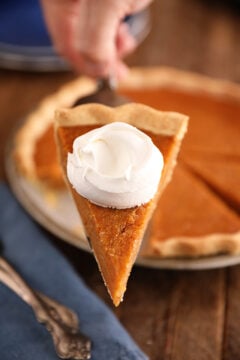 Slice of Sweet Potato Pie with whipped cream.