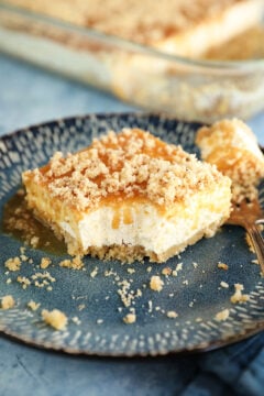 Bite missing from slice of Caramel Pecan Shortbread No-Bake Cheesecake