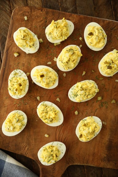Dill Pickle Deviled Eggs on cutting board
