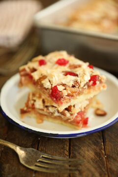 Cherry Coconut Pecan Bars stacked on a plate