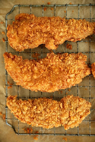 Saltine Crusted Chicken Tenders on a cooling rack