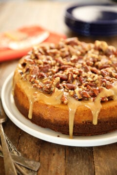 Easy Pumpkin Cheesecake with Pecan Pie Topping with caramel drizzle