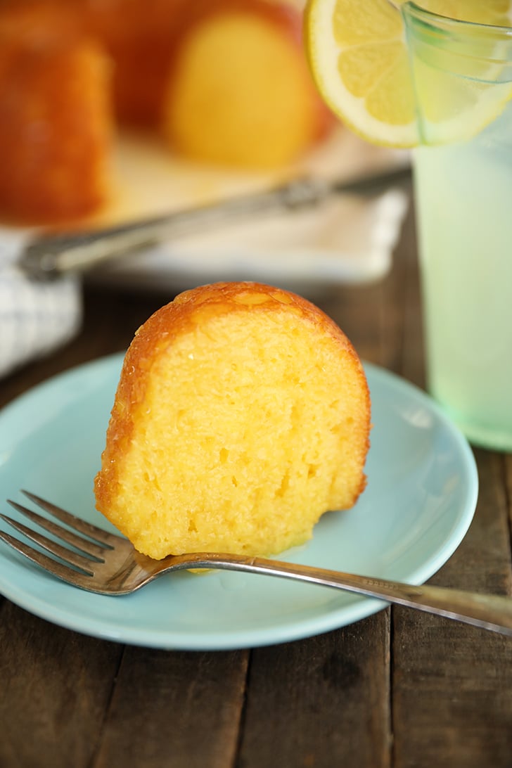 Single slice of Lemonade Cake on blue plate.