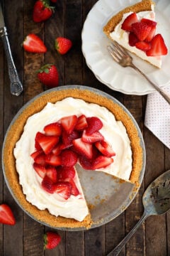 Overhead view of Strawberry Cream Cheese Pie with one piece missing.