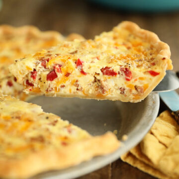 Sideview of slice of Bacon and Pimento Cheese Quiche
