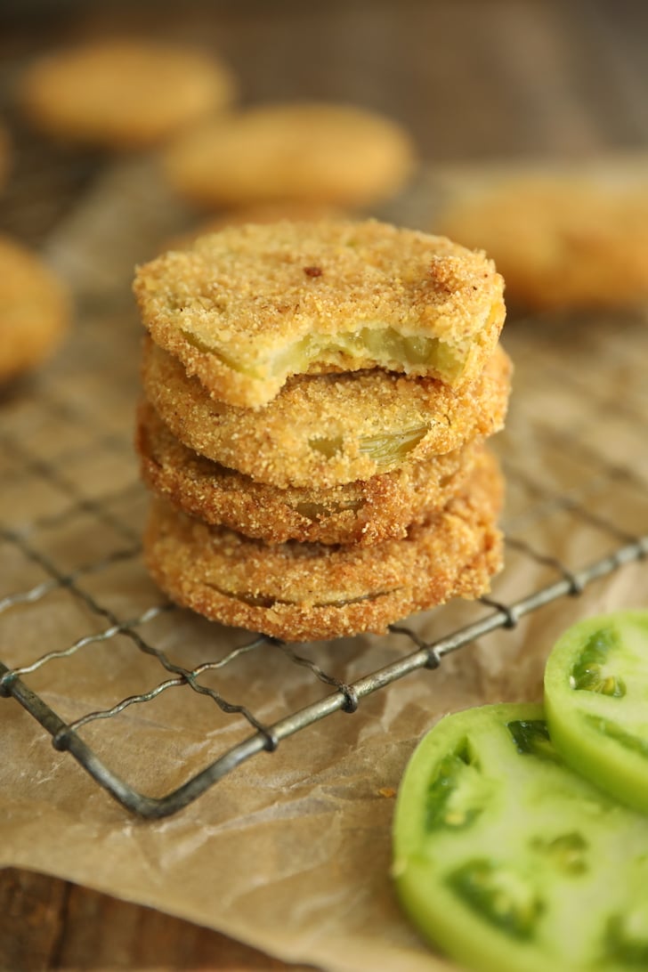 stack of fried green tomatoes with bite missing from one.