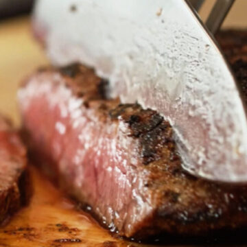 slicing skirt steak against the grain.