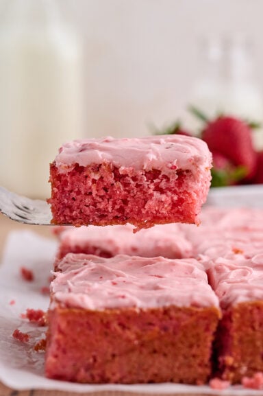 Slice of Strawberry Sheet Cake on server.