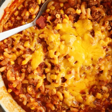 Overhead view of goulash with cheese.