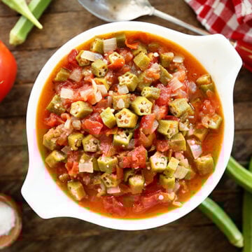 Okra and Tomatoes in a white bowl.