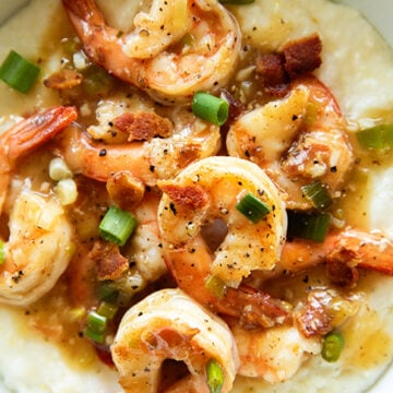overhead view of shrimp and sauce over grits.