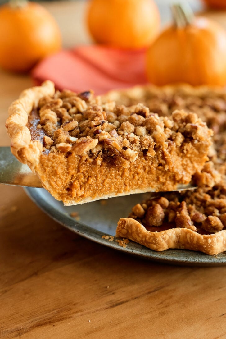 Taking out a piece of Pumpkin Pie.