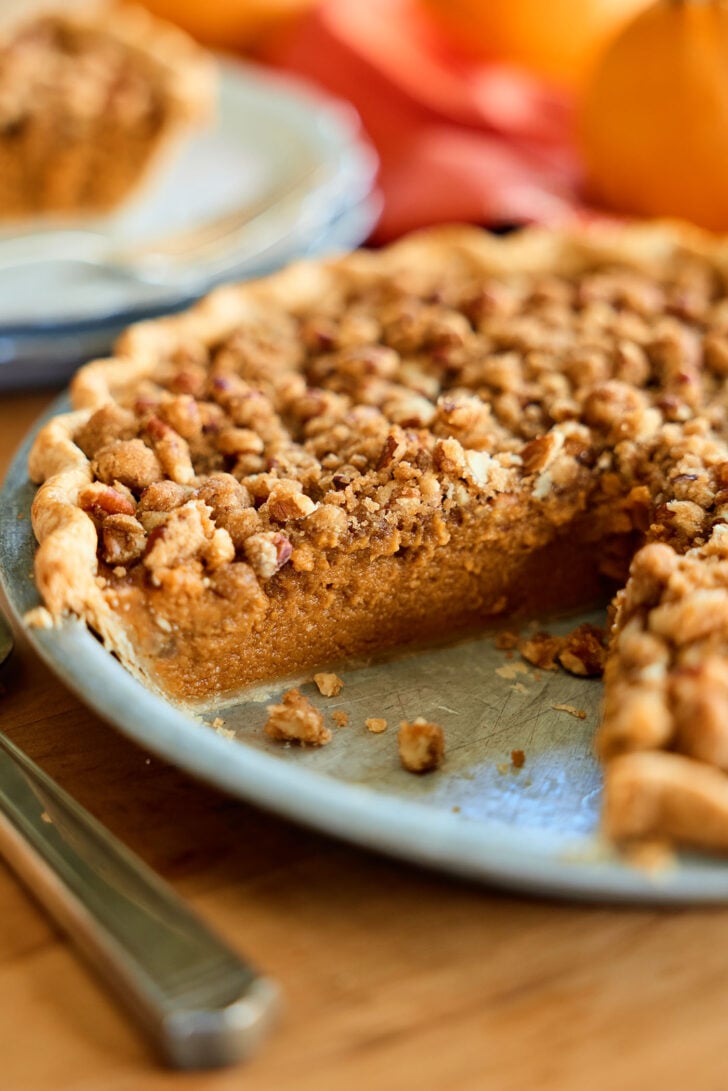 Pumpkin Pie with slice missing.