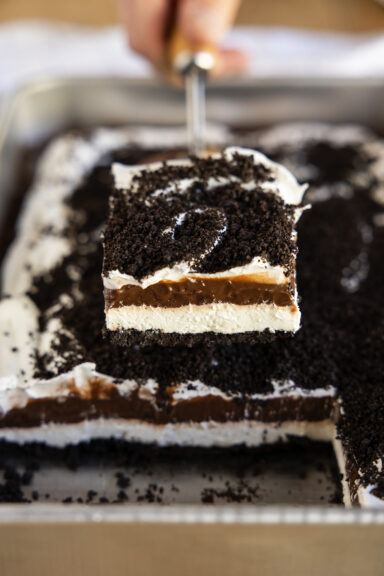 Slice of Oreo Delight on a spatula.