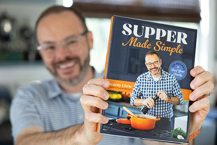 Stacey holding the cookbook.