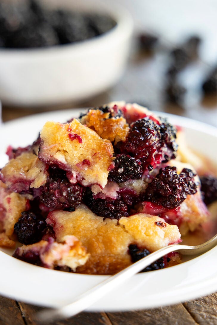 Serving of blackberry cobbler in a bowl.