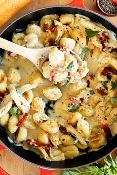 Close-up of Marry Me Chicken Gnocchi with a spoon in it.